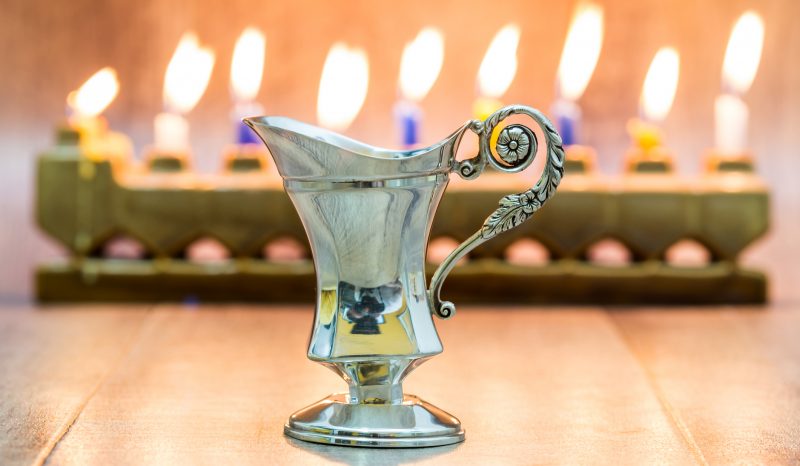 menorah with oil jug